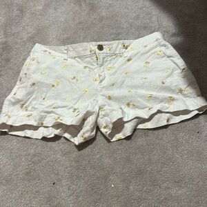 Old Navy size 4 white shorts with gold palm trees. Perfect used condition.